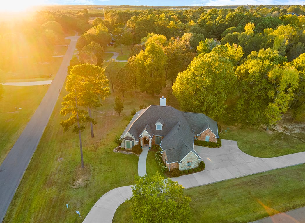 Drone Aerial at Sunset Showing Backyard and Trees - 1 Beaver Creek Run Texarkana TX 75501