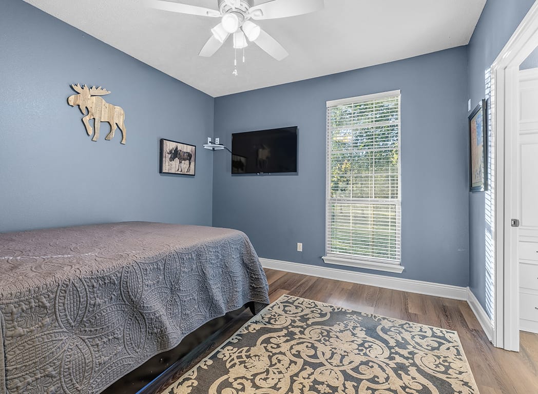 Guest Bedroom with Gray Walls and Ceiling Fan With A View