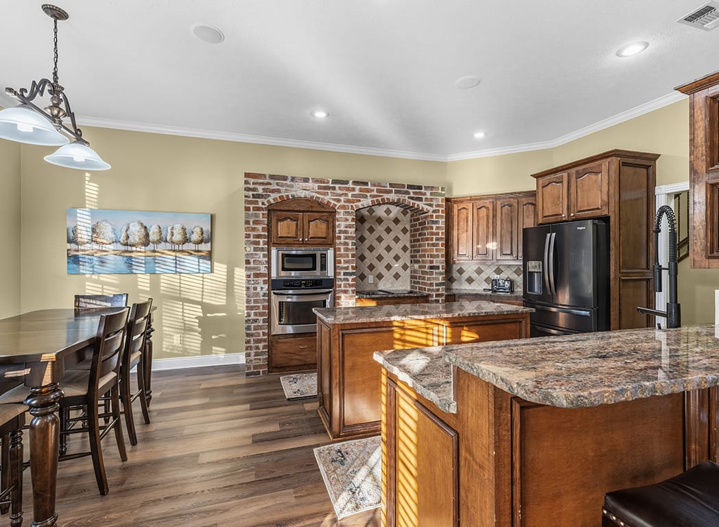 Kitchen with Tile Backsplash and Modern Lighting