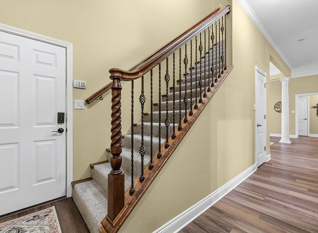 Staircase and Hallway with Wooden Banister